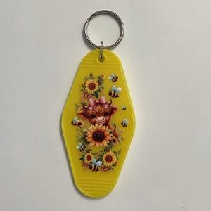 Yellow Keychain with Cute Cow and Sunflower Design